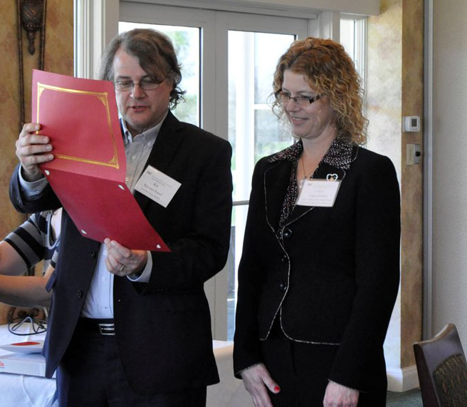 Dean Kai von Fintel presenting the MIT Inspirational Teacher award to Carrie Schultz.