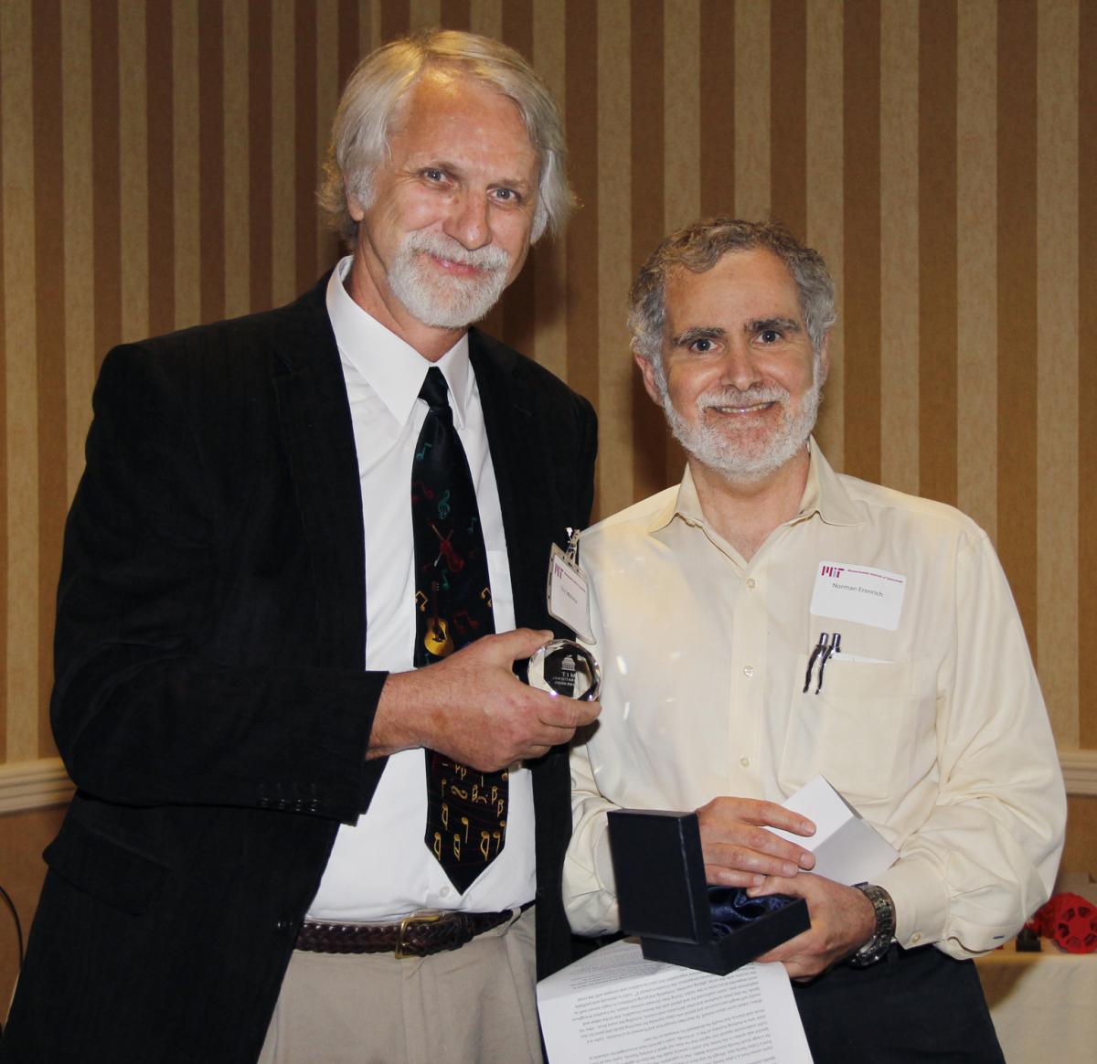 Stuart Greydanus (left) receiving his award from Norman Erenrich '72.